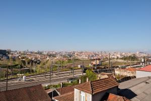 a view of a train station in a city at Wander Unwind - Wine Cellars in Vila Nova de Gaia