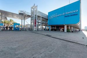 a shopping mall with a large blue sign on it at Case Sole e Luna in Genoa