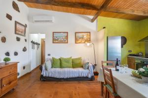 a living room with a couch and a table at vv - La Casa Verde in Las Casas