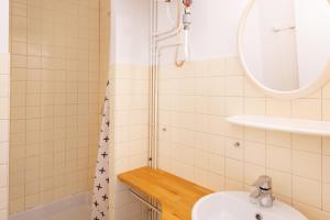 a bathroom with a sink and a shower at Les Mimosas - Appartement 06 in Cazaubon +12 photos