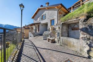 a house on a hill with a street at Chalet Al Volt in Tremosine Sul Garda