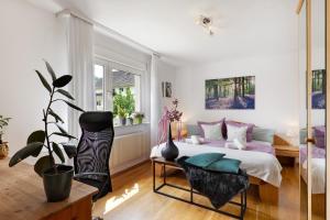 a bedroom with a king sized bed and a window at Fewo Sartorius in Bensheim