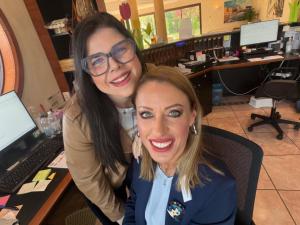 two women posing for a picture in front of a computer at Hotel Porto Azzurro in Sirmione +111 photos