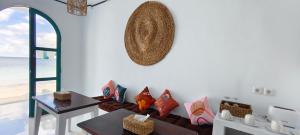 a living room with a couch and a table at Casa di Stella in Ngurblut +26 photos