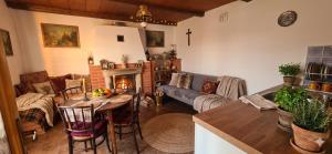 a living room with a couch and a table at Stateček plný zvířátek in Žlebské Chvalovice