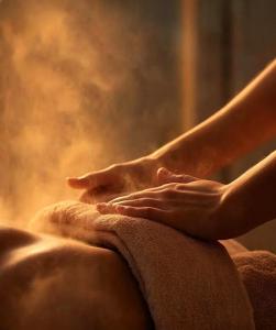 a person is washing their hands on a towel at M Panda Tower Boutique Chengdu in Chengdu