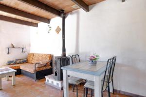 a living room with a table and a couch at Casa Azul - Vejer, El Palmar in Vejer de la Frontera