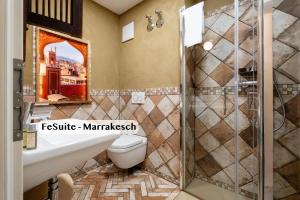 a bathroom with a toilet and a shower at Boutique Suites anno 1789 by Kamelu in Gengenbach