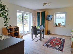 an office with a desk and a chair in a room at Ferienwohnung Abendsonne in Nagel
