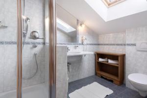 a bathroom with a shower and a toilet and a sink at Haus Peer Burgeis in Malles Venosta +93 photos