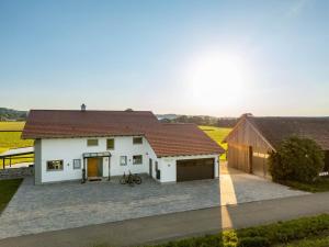 a white house with a brown roof at Ferienwohnung Egg-Hof in Bad Grönenbach