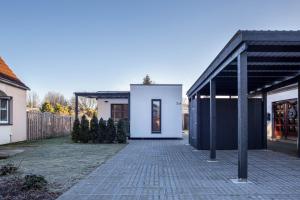 a white house with a black roof at Ferienhaus Spaden in Spaden
