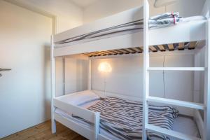 a bedroom with two bunk beds in a room at Ferienhaus Spaden in Spaden