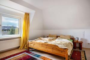 a bedroom with a bed and a window at Haus Sonnenschein in Pahlen
