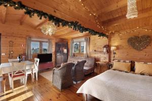 a bedroom with a bed and a dining room at Casa da Lagoa Pateira in Fermentelos +20 photos