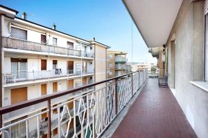 a balcony of an apartment building with a walkway at Casa Rose di Mare in Albenga