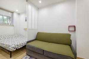 a room with a couch and a bed in it at Studio - 2 couchages doubles in Villeneuve-Loubet