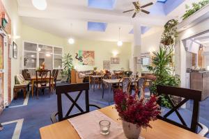 a restaurant with tables and chairs and a dining room at Albrechtshof in Potsdam