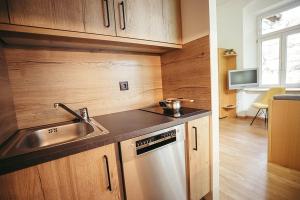 a kitchen with a sink and a counter top at Freienfeldhof Golden in Lagundo