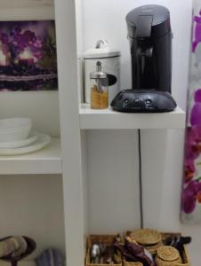 a coffee maker on a shelf in a kitchen at Apartment zu Hofe in Oberursel +46 photos