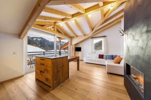 a living room with a couch and a fireplace at Naturoase Stegerhof Apt Margerite in Trodena