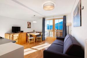 a living room with a couch and a table at Haus Peer Burgeis in Malles Venosta