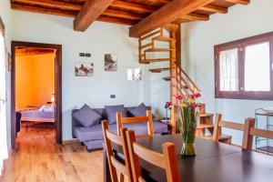 a living room with a table and a couch at Vento di Maremma in Marina di Grosseto