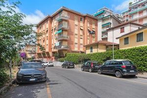 a group of cars parked on the side of a street at Casa Parco Casale in Rapallo