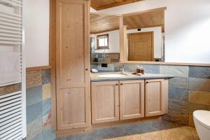 a bathroom with a sink and a toilet at Chalet La Fiamma in Santa Caterina Valfurva