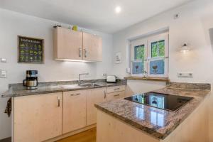 a kitchen with a sink and a counter top at Müllerleile Hof in Haslach im Kinzigtal