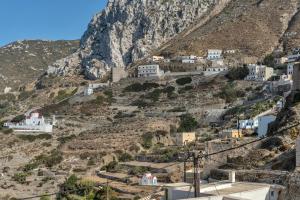 a village on the side of a mountain at Villa Houvarda in Karpathos +16 photos