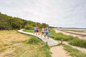 a group of people walking on a path at Le Goéland in Sarzeau