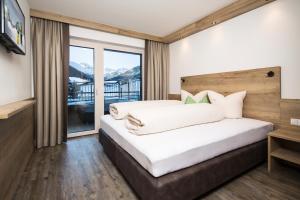 Cama ou camas em um quarto em Alps Tux