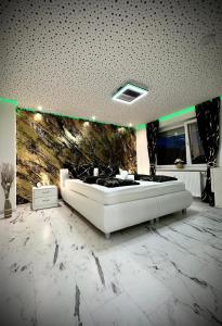 a room with a large white tub in the middle of a room at Deluxe - Apartment 'Andrei 2' in Neuburg an der Donau