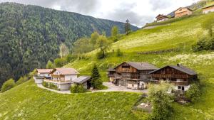 an aerial view of a house on a hill at Tratterhof Apt Eidechsspitze in Vandoies