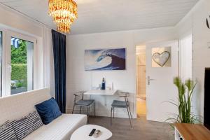 a living room with a couch and a table at Ruheoase Kummerower See in Kummerow
