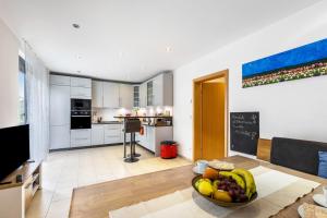 a living room with a bowl of fruit on a table at Wohnung mit 3 Schlafzimmern in Solingen