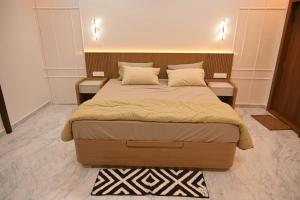 a bedroom with a large bed with two night stands at Crystal Water in Mulshi +36 photos