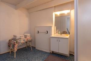 a bathroom with a sink and a mirror at Maison Sarzeau Centre - La Bernache in Sarzeau +15 photos