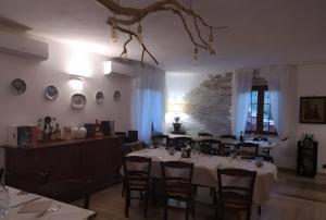 a dining room with a table and chairs in it at Agriotto Agriturismo in Savona +17 photos