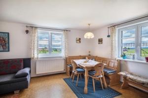 a living room with a table and a couch at Haus Moritz in Heimenkirch