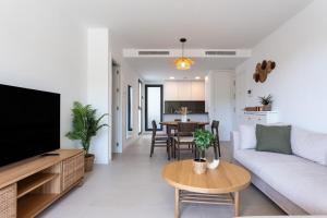 a living room with a couch and a table at Middle Views West in Fuengirola