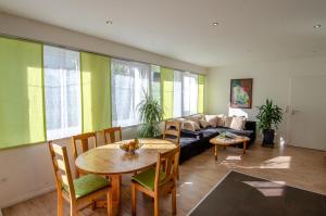 a living room with a table and a couch at Haus Sieber in Schiltach