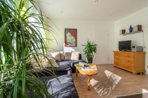 a living room with a couch and a table at Haus Sieber in Schiltach