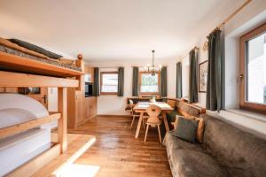 a living room with a couch and a table at Rieplechn App in Sand in Taufers