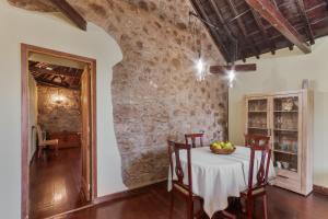 a dining room with a table with a bowl of fruit on it at Casa Isabel in Santa Brígida