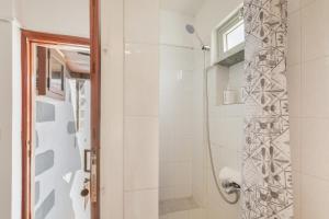 a bathroom with a shower and a glass door at Casa Isabel in Santa Brígida +24 photos