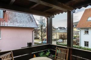 a view from the porch of a house with two chairs at Ferienwohnung Altstadtblick in Alsfeld