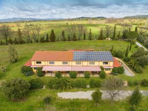 an aerial view of a house with solar panels on it at Il Nazareno - Il Gheppio in Cecina