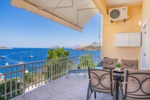 a balcony with a view of the ocean at Anna House in Panteli +22 photos